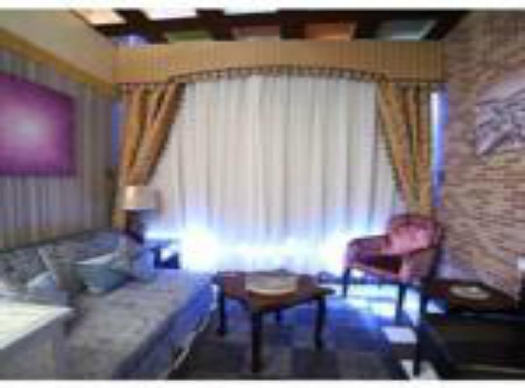 כוויית Roomi Suites Hotel חדר תמונה